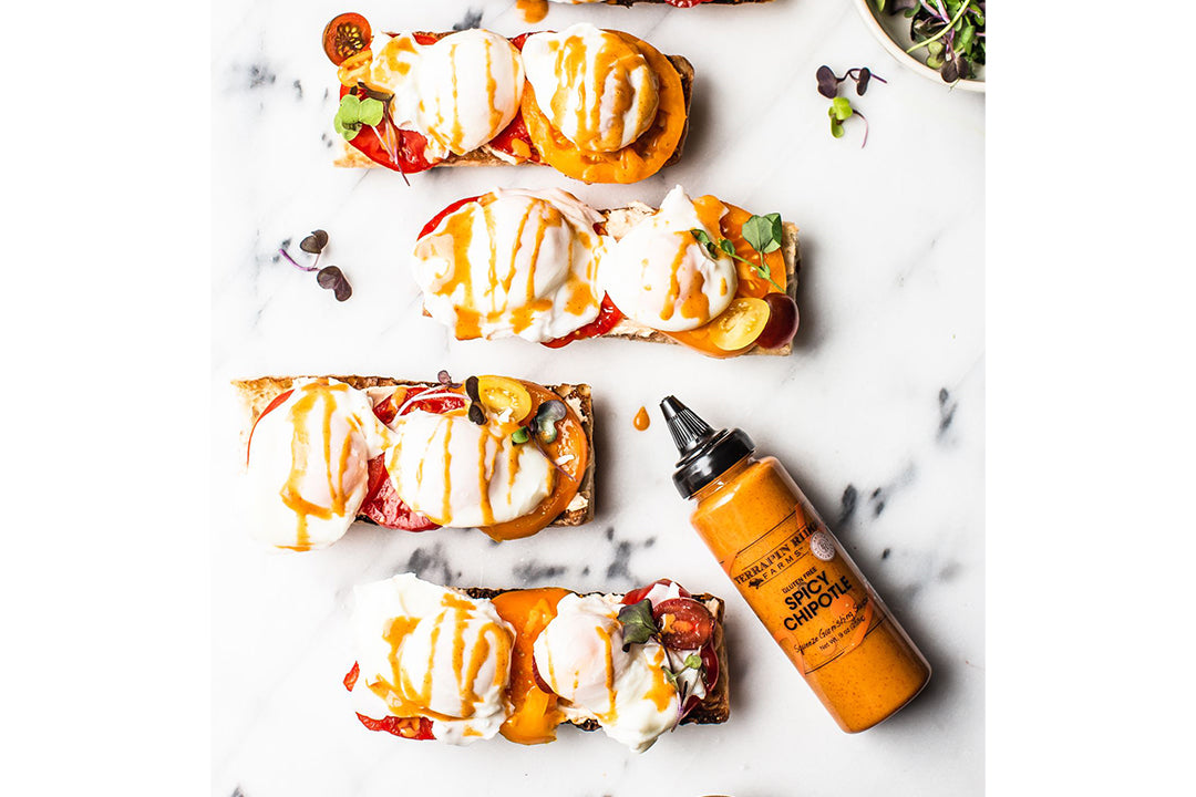 Chipotle Eggs Benedict with Goat Cheese Spread on a french baguette