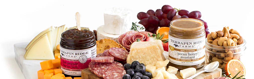 View A spread of Terrapin Ridge jam and mustard products, cheeses, fruits, and meats. You can click on this image to view all Terrapin Ridge products.